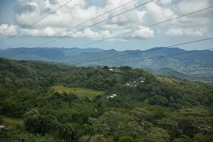 Framed Print : Panorama drone shot over rainforest on Flores with green hills in background Framed Print : Panorama drone shot over rainforest on Flores with green hills in background