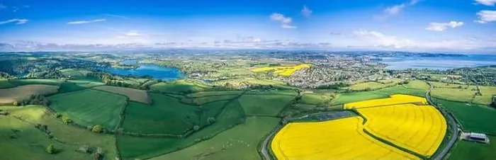 Framed Print : Panorama over Farmlands and Rapeseed fields from a drone, Devon, England Framed Print : Panorama over Farmlands and Rapeseed fields from a drone, Devon, England