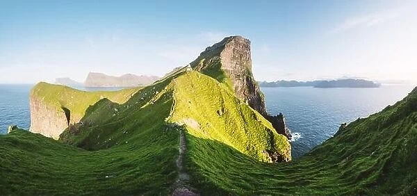 Panorama of green faroese hills and Kallur lighthouse on Kalsoy island, Faroe islands, Denmark. Landscape photography