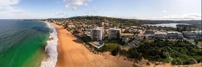 Framed Print : panorama of narrabeen beach and lagoon on a sunny day with apartments on the beach Framed Print : panorama of narrabeen beach and lagoon on a sunny day with apartments on the beach