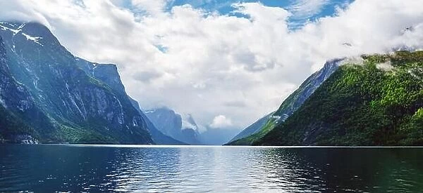 Panorama of picturesque landscape with mountains, cloudy sky and lovatnet lake, Sogn og Fjordane county, Norway. Landscape photography