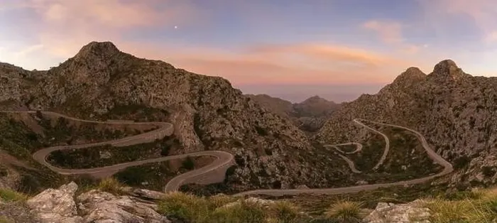 Framed Print : panorama sunrise landscape in the Tramuntana mountains of Mallorca with a view of the landmark snake road leading down Framed Print : panorama sunrise landscape in the Tramuntana mountains of Mallorca with a view of the landmark snake road leading down