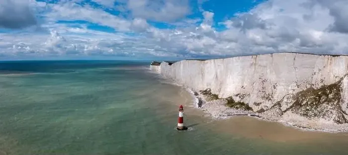 Framed Print : A panorama view of the Beachy Head Lighthouse in the English Channel and the white cliffs of the Jurassic Coast Framed Print : A panorama view of the Beachy Head Lighthouse in the English Channel and the white cliffs of the Jurassic Coast
