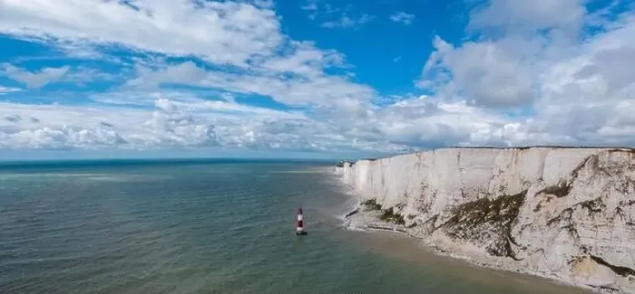 Framed Print : A panorama view of the Beachy Head Lighthouse in the English Channel and the white cliffs of the Jurassic Coast Framed Print : A panorama view of the Beachy Head Lighthouse in the English Channel and the white cliffs of the Jurassic Coast