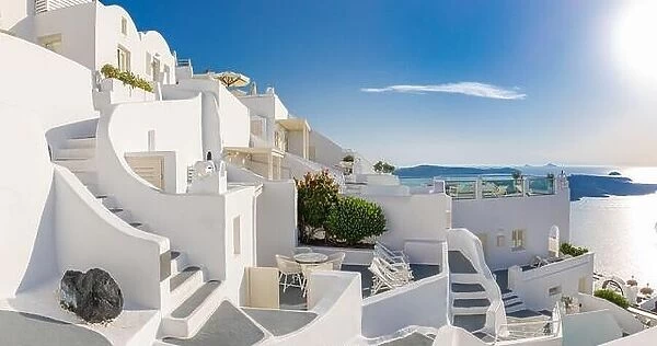 A panorama view of the caldera in Santorini in summertime. Amazing white architecture, fantastic travel destination, luxury resort, houses and sea