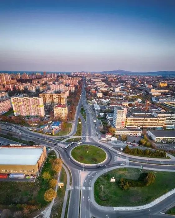 Framed Print : Panorama view of the road with a circular motion and a flower bed at sunset. Aerial photography