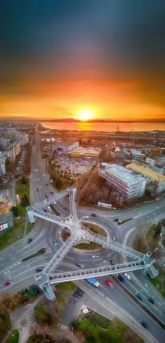 Framed Print : Panorama view of the road with a circular motion and a flower bed at sunset. Aerial photography Framed Print : Panorama view of the road with a circular motion and a flower bed at sunset. Aerial photography