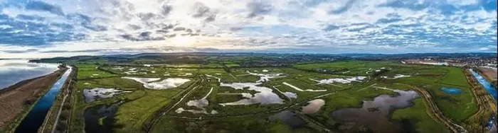 Framed Print : Panorama over Wetlands and Marshes in RSPB Exminster and Powderham Marshe from a drone, Exeter, Devon, England