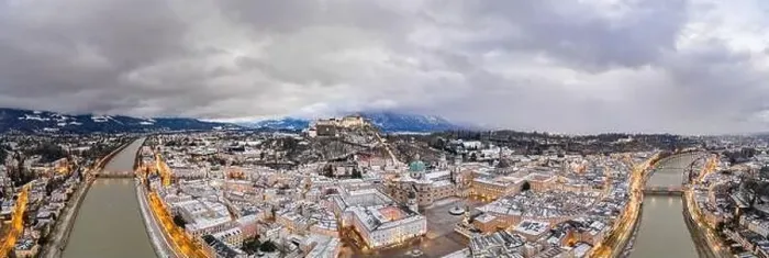 Framed Print : Panoramic aerial drone overview of Salzburg old town skyline covered with snow Framed Print : Panoramic aerial drone overview of Salzburg old town skyline covered with snow
