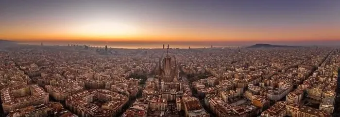 Framed Print : Panoramic aerial drone shot of Barcelona city skyline with church before sunrise in winter Framed Print : Panoramic aerial drone shot of Barcelona city skyline with church before sunrise in winter