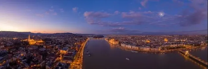 Framed Print : Panoramic aerial drone shot of Danube river with lighted quai with purple sky during Budapest sunset Framed Print : Panoramic aerial drone shot of Danube river with lighted quai with purple sky during Budapest sunset