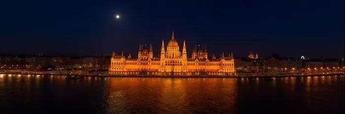 Framed Print : Panoramic aerial drone shot of front facade of Hungarian Parliament with lights on in Budapest night Framed Print : Panoramic aerial drone shot of front facade of Hungarian Parliament with lights on in Budapest night