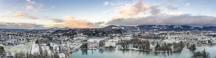 Framed Print : Panoramic aerial drone shot view of Leopoldskroner lake southwest of outskirts of Salzburg during winter