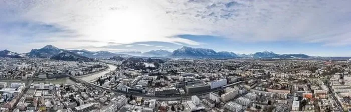 Framed Print : Panoramic aerial drone shot view of Salzburg aiglhof station with view of eastern bavarian alps mountain