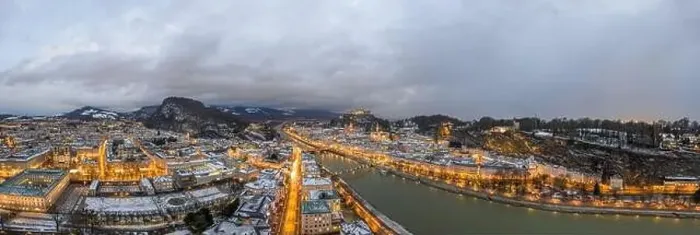 Framed Print : Panoramic aerial drone view of Salzburg snowy old town with city light on at dusk hour in winter Framed Print : Panoramic aerial drone view of Salzburg snowy old town with city light on at dusk hour in winter