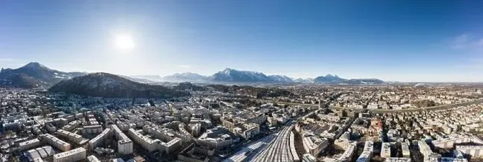 Framed Print : Panoramic aerial drone view of Salzburg snowy old town with view of Unesberg Kapuzinerberg mountain and train station Framed Print : Panoramic aerial drone view of Salzburg snowy old town with view of Unesberg Kapuzinerberg mountain and train station
