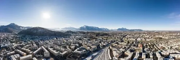 Framed Print : Panoramic aerial drone view of Salzburg snowy old town with view of Unesberg Kapuzinerberg mountain and train station Framed Print : Panoramic aerial drone view of Salzburg snowy old town with view of Unesberg Kapuzinerberg mountain and train station