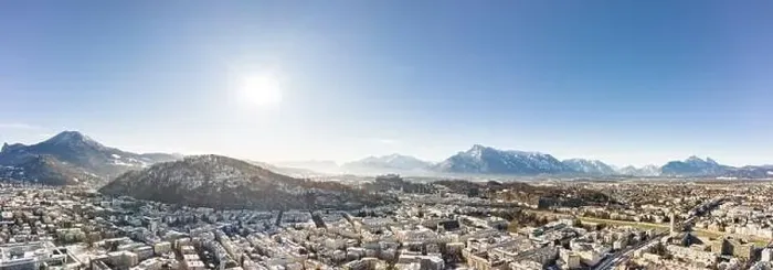 Framed Print : Panoramic aerial drone view of Salzburg snowy old town with view of Unesberg Kapuzinerberg mountain in winter morning Framed Print : Panoramic aerial drone view of Salzburg snowy old town with view of Unesberg Kapuzinerberg mountain in winter morning