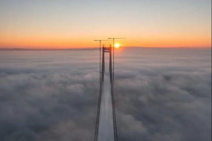 Framed Print : Panoramic aerial drone view from above of the suspended bridge over danube river, under construction, between Braila and Tulcea cities in Romania Framed Print : Panoramic aerial drone view from above of the suspended bridge over danube river, under construction, between Braila and Tulcea cities in Romania