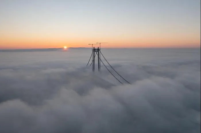 Framed Print : Panoramic aerial drone view from above of the suspended bridge over danube river, under construction, between Braila and Tulcea cities in Romania Framed Print : Panoramic aerial drone view from above of the suspended bridge over danube river, under construction, between Braila and Tulcea cities in Romania
