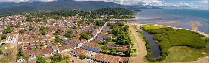Framed Print : Panoramic aerial view to historic town Paraty with green mountains and sea in background on a sunny Framed Print : Panoramic aerial view to historic town Paraty with green mountains and sea in background on a sunny