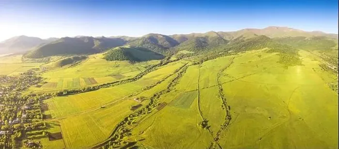 Framed Print : Panoramic aerial view of lush green fields and village houses Framed Print : Panoramic aerial view of lush green fields and village houses