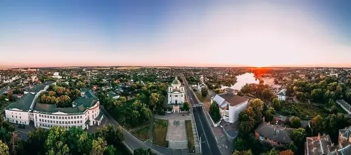 Framed Print : Panoramic aerial view of two old churches near river and bridge in small european city at summer day Framed Print : Panoramic aerial view of two old churches near river and bridge in small european city at summer day