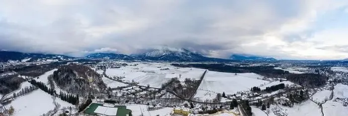 Framed Print : Panoramic aerial view of Salzburg outskirts snowy villages during sunset hour with clouds after snow storm in winter Framed Print : Panoramic aerial view of Salzburg outskirts snowy villages during sunset hour with clouds after snow storm in winter