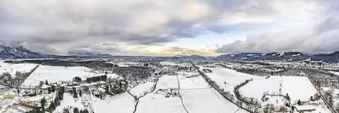 Framed Print : Panoramic aerial view of Salzburg outskirts snowy villages during sunset hour with clouds after snow storm in winter Framed Print : Panoramic aerial view of Salzburg outskirts snowy villages during sunset hour with clouds after snow storm in winter