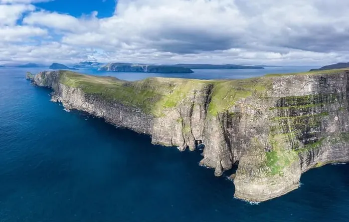 Framed Print : Panoramic aerial view from Sandoy island cliffs under the clouds, Faroe Islands Framed Print : Panoramic aerial view from Sandoy island cliffs under the clouds, Faroe Islands