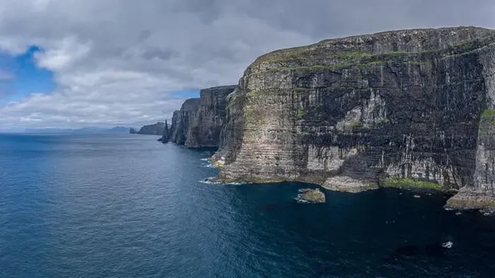 Framed Print : Panoramic aerial view from Sandoy island cliffs and rock stacks under the clouds, Faroe Islands Framed Print : Panoramic aerial view from Sandoy island cliffs and rock stacks under the clouds, Faroe Islands