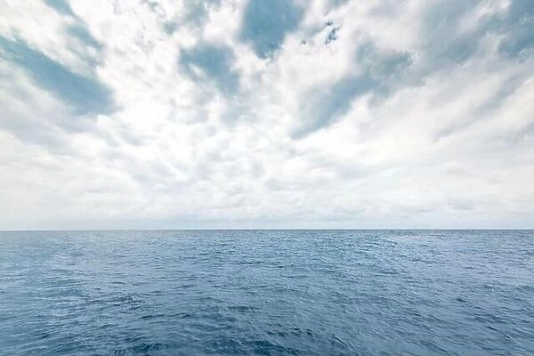 Panoramic beautiful seascape with cloud on a sunny day. Overcast sea or ocean water with horizon