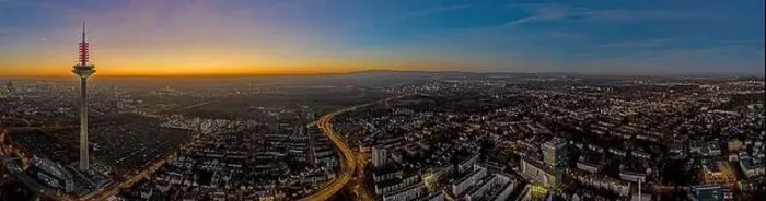 Framed Print : Panoramic drone image of the Frankfurt skyline with television tower in the evening during a colorful Framed Print : Panoramic drone image of the Frankfurt skyline with television tower in the evening during a colorful