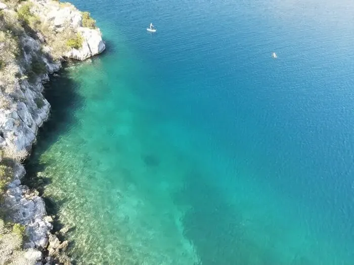 Framed Print : Panoramic drone photo of the tropical beach and a SUP paddleboard in the bay of Toroni in Halkidiki, Greece Framed Print : Panoramic drone photo of the tropical beach and a SUP paddleboard in the bay of Toroni in Halkidiki, Greece