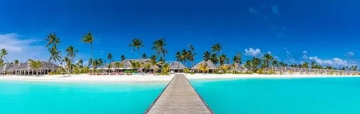 Framed Print : Panoramic view of exotic palm trees and lagoon on the tropical Island beach. Luxury resort hotel, villas, bungalows with wooden jetty. Amazing travel Framed Print : Panoramic view of exotic palm trees and lagoon on the tropical Island beach. Luxury resort hotel, villas, bungalows with wooden jetty. Amazing travel