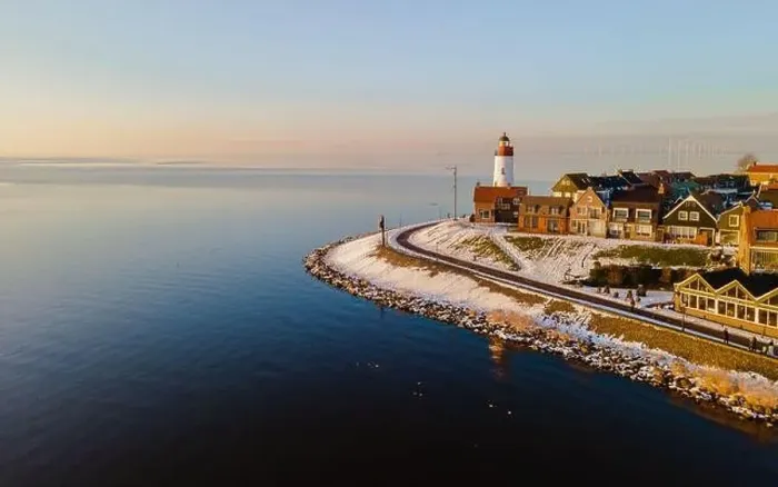 Framed Print : panoramic view of the Lighthouse of Urk during winter with snow landscape in the Netherlands Framed Print : panoramic view of the Lighthouse of Urk during winter with snow landscape in the Netherlands