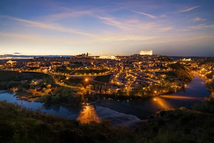 Framed Print : Panoramic view of the medieval center of the city of Toledo, Spain. It features the Tejo river, the Cathedral and Alcazar of Toledo, Spain Framed Print : Panoramic view of the medieval center of the city of Toledo, Spain. It features the Tejo river, the Cathedral and Alcazar of Toledo, Spain