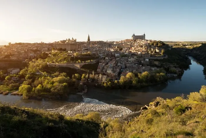 Framed Print : Panoramic view of the medieval center of the city of Toledo, Spain. It features the Tejo river, the Cathedral and Alcazar of Toledo, Spain Framed Print : Panoramic view of the medieval center of the city of Toledo, Spain. It features the Tejo river, the Cathedral and Alcazar of Toledo, Spain