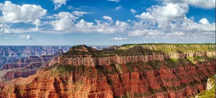 Framed Print : Panoramic view of the North Rim of the Grand Canyon looking across the canyons to a tall mountain plateau under a Framed Print : Panoramic view of the North Rim of the Grand Canyon looking across the canyons to a tall mountain plateau under a