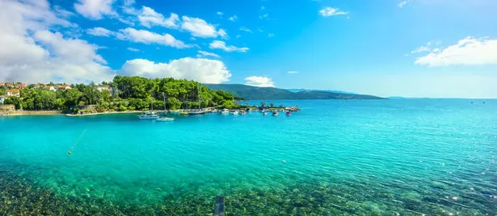 Framed Print : Panoramic view of waterfront with turquoise bay and beach in Krk. Krk island, Croatia Framed Print : Panoramic view of waterfront with turquoise bay and beach in Krk. Krk island, Croatia