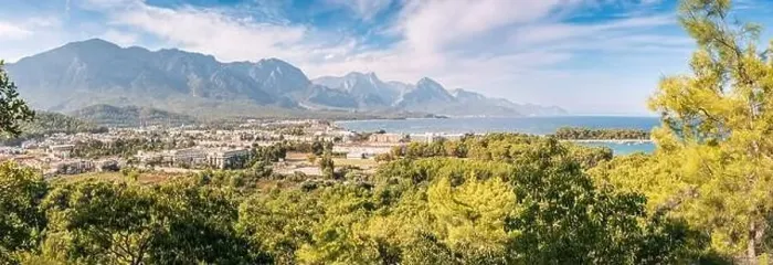 Framed Print : a panoramic vista of Kemer's hotels harmoniously nestled between a picturesque sea beach and awe-inspiring mountains Framed Print : a panoramic vista of Kemer's hotels harmoniously nestled between a picturesque sea beach and awe-inspiring mountains