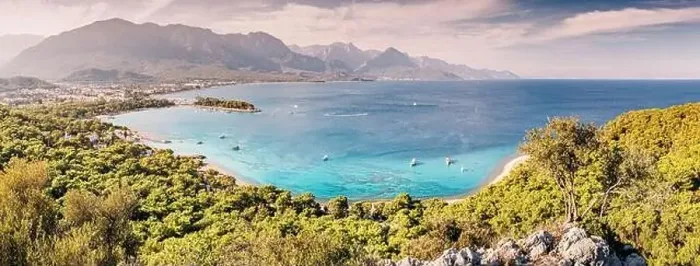 Framed Print : a panoramic vista of Kemer's hotels harmoniously nestled between a picturesque sea beach and awe-inspiring mountains Framed Print : a panoramic vista of Kemer's hotels harmoniously nestled between a picturesque sea beach and awe-inspiring mountains