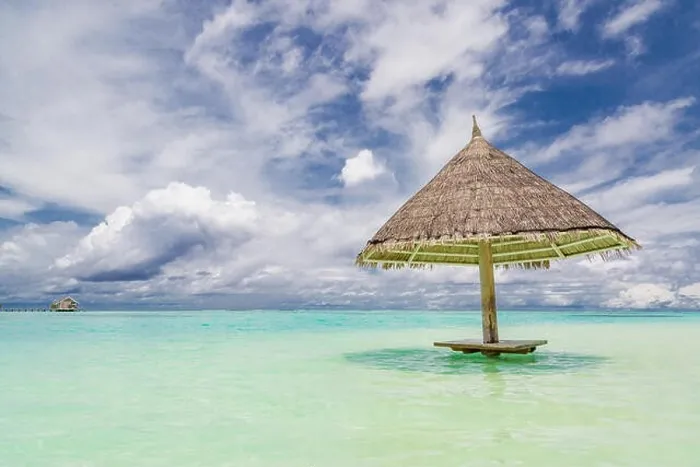 Framed Print : Parasol beach on the coast. White sand and blue water of the sea. Panorama at beach Framed Print : Parasol beach on the coast. White sand and blue water of the sea. Panorama at beach
