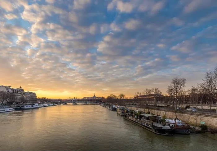 Framed Print : Paris, France - February 12, 2021: Seine river and Grand Palais in background with a beautiful cloudy sunset in Paris Framed Print : Paris, France - February 12, 2021: Seine river and Grand Palais in background with a beautiful cloudy sunset in Paris