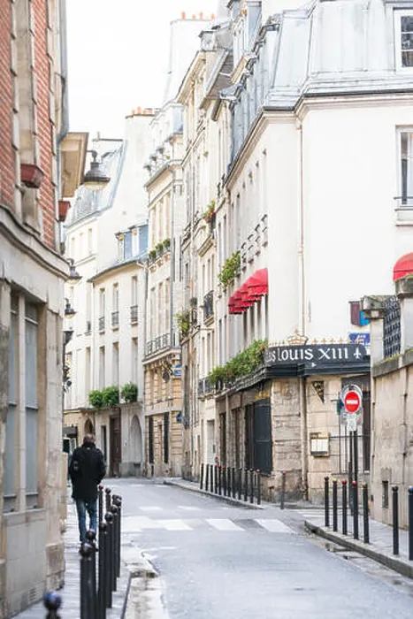 Framed Print : Paris, France - March 2, 2016: Man walking down rue des Grands Augustins in Monnaie on the Left Bank, Paris, France Framed Print : Paris, France - March 2, 2016: Man walking down rue des Grands Augustins in Monnaie on the Left Bank, Paris, France