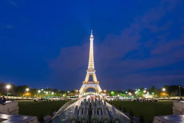 Framed Print : PARIS, FRANCE - May 8, 2016: Tourist sightseeing beautiful night scene of illuminated Eiffel Tower at dusk, Paris, France Framed Print : PARIS, FRANCE - May 8, 2016: Tourist sightseeing beautiful night scene of illuminated Eiffel Tower at dusk, Paris, France