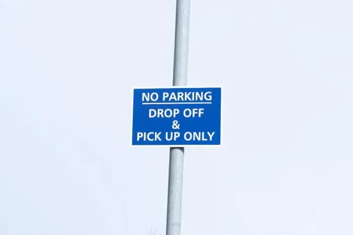 Framed Print : No parking drop off and pick up only sign post in sky at airport Framed Print : No parking drop off and pick up only sign post in sky at airport