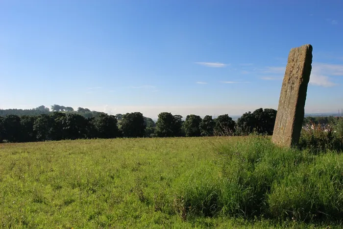 Framed Print : Parkmill Cross Slab carved standing stone near Alloa, Clackmannanshire with Clackmannan Tower on the horizon Framed Print : Parkmill Cross Slab carved standing stone near Alloa, Clackmannanshire with Clackmannan Tower on the horizon