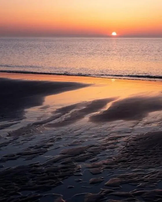 Framed Print : pattern in sand and colorful reflection of setting sun in water Framed Print : pattern in sand and colorful reflection of setting sun in water