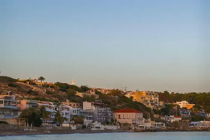Framed Print : A peaceful coastal neighborhood at dusk with buildings nestled along the hillside and overlooking the sea Framed Print : A peaceful coastal neighborhood at dusk with buildings nestled along the hillside and overlooking the sea